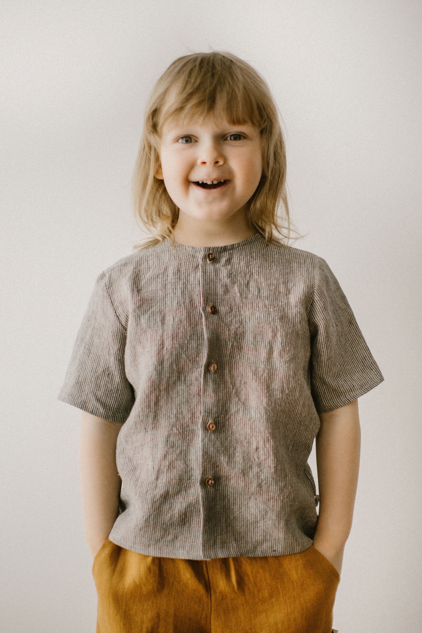 It has short sleeves and button up design, and is created for the most comfort of your little boys.