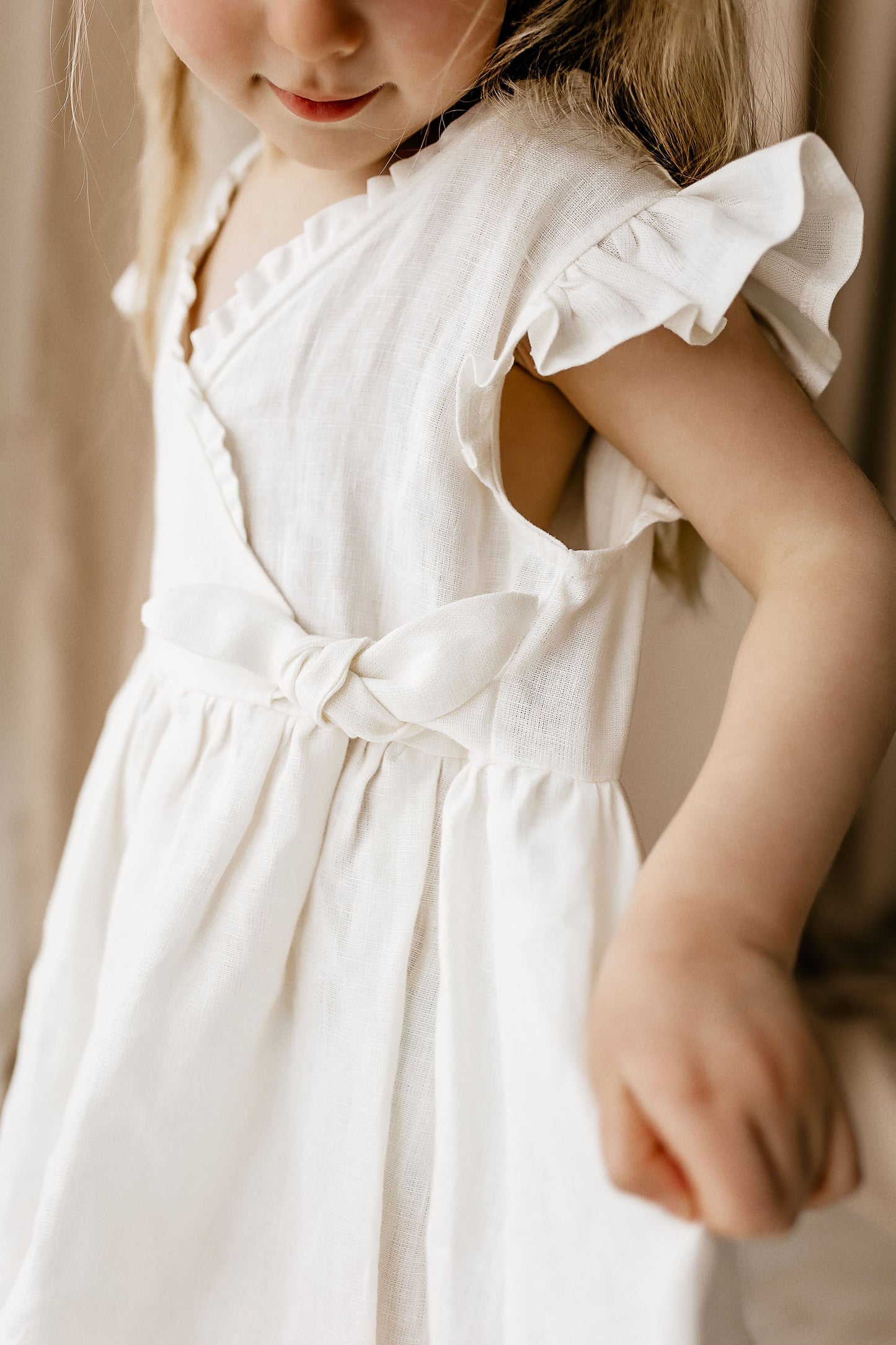 This simply adorable, cutest ever linen girl dress JASMINE with ruffles on shoulders and along the V neck.